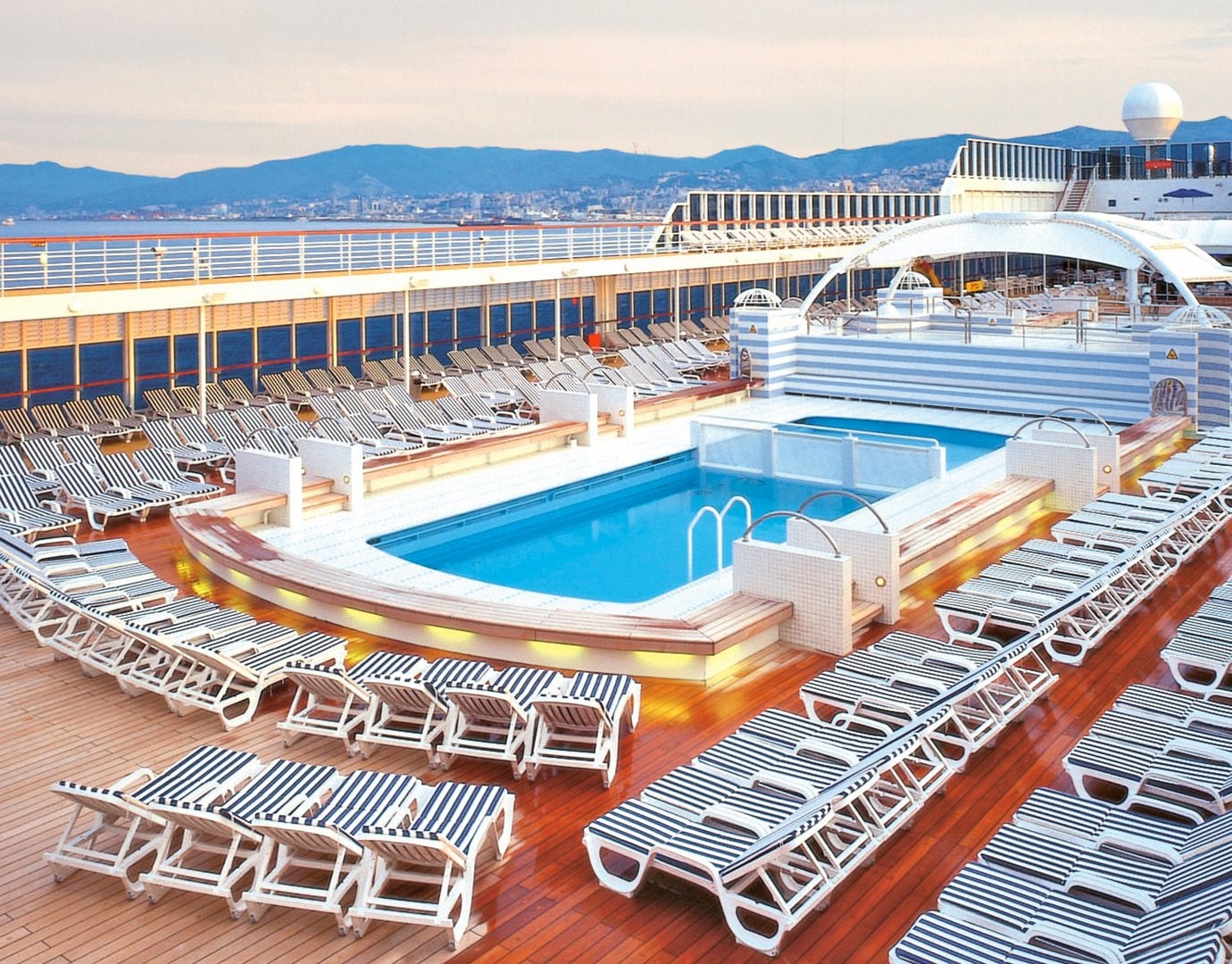 Sun loungers by pool